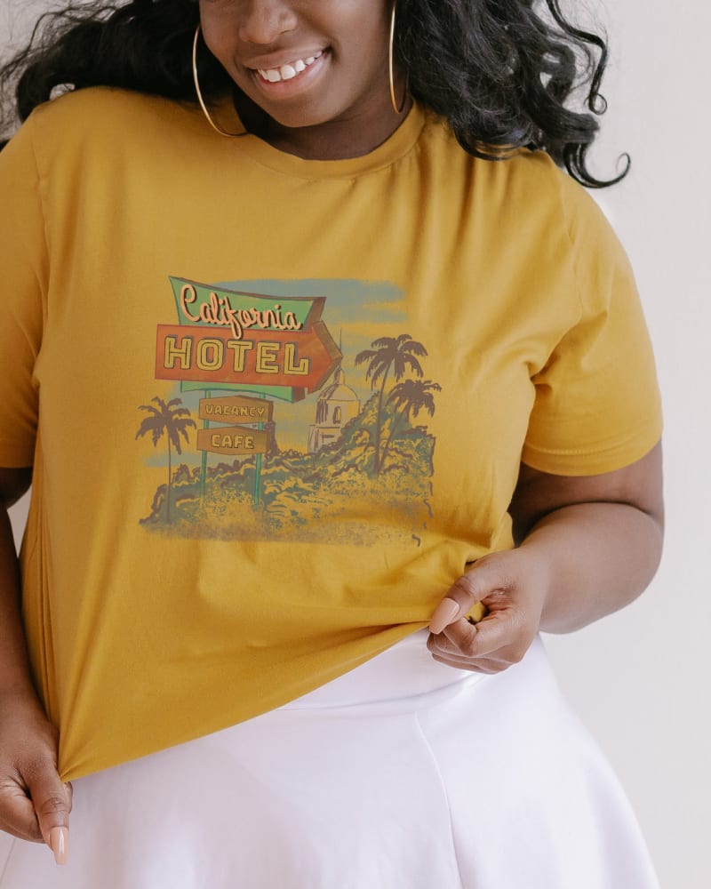 Front of a model wearing a size Large California Hotel in Mustard by Simply Sage Market. | dia_product_style_image_id:281671